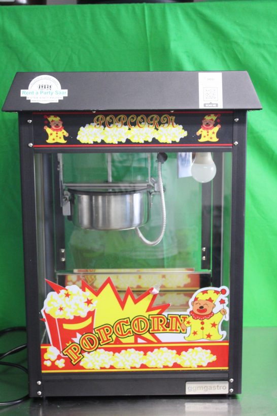 Popcornmaschine mit einem transparenten Behälter und buntem, explosivem Design.